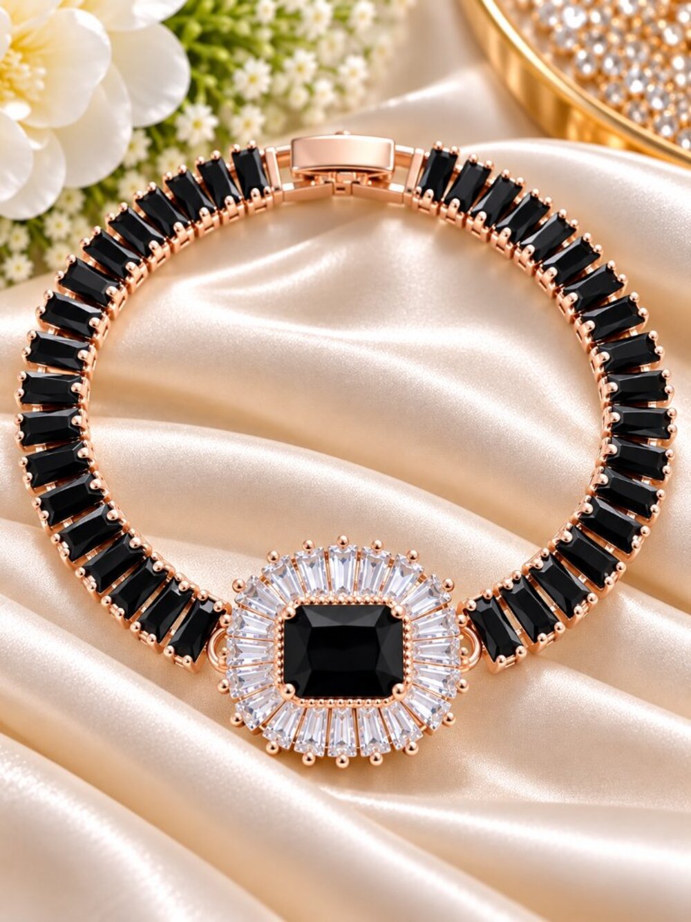 Rose-gold-tone bracelet featuring sleek black baguette-cut crystals